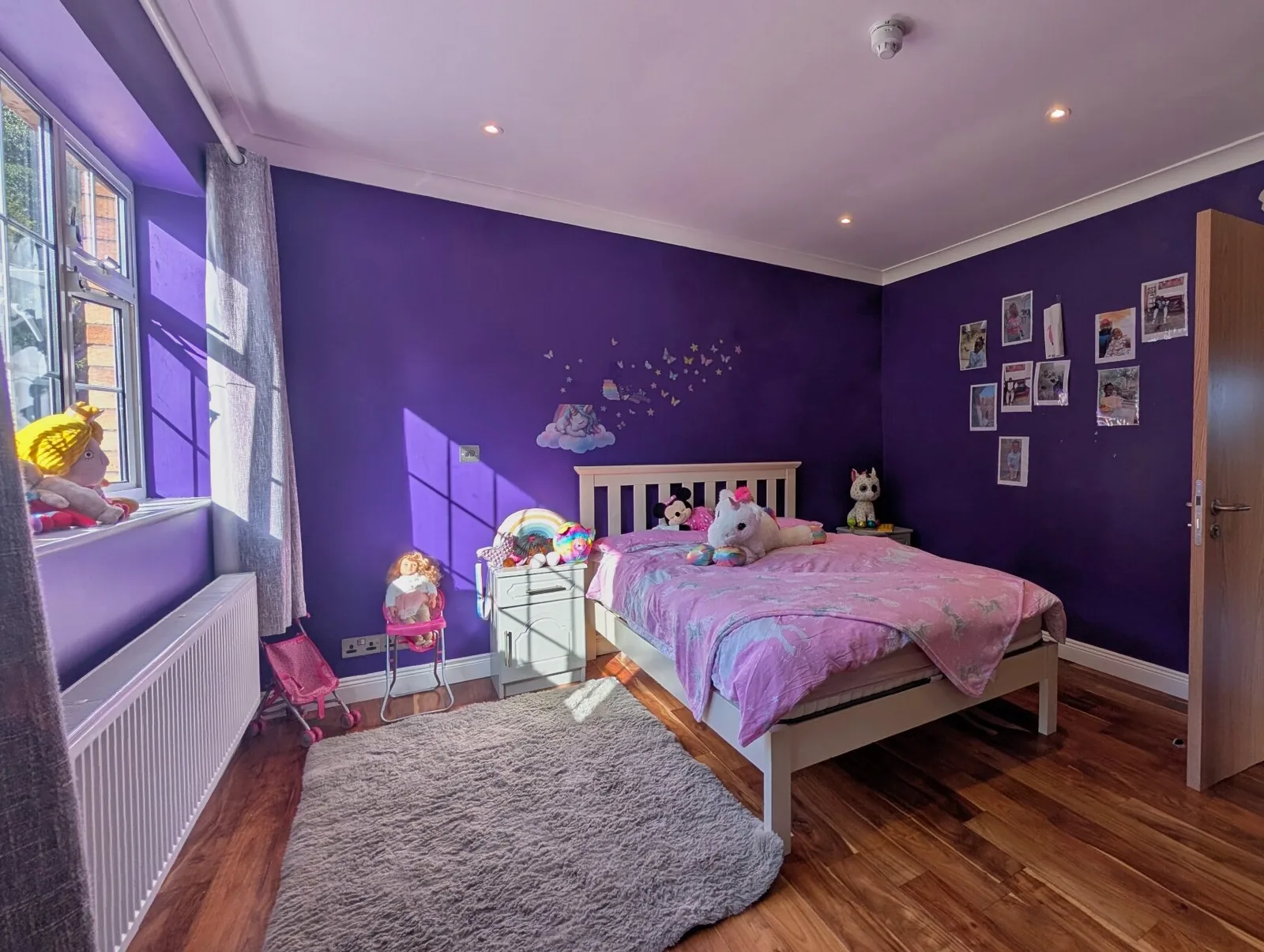 A bedroom decorated in purple